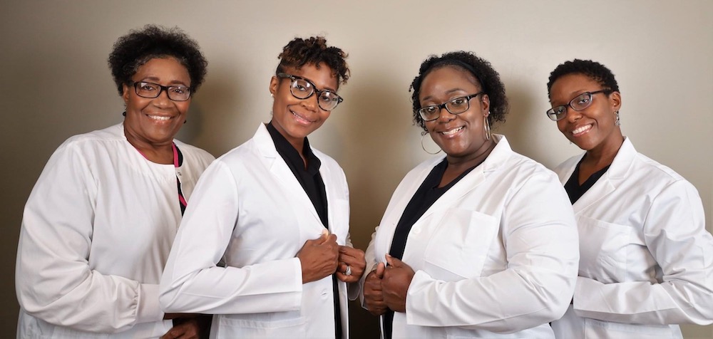 McNeal sisters in white coat