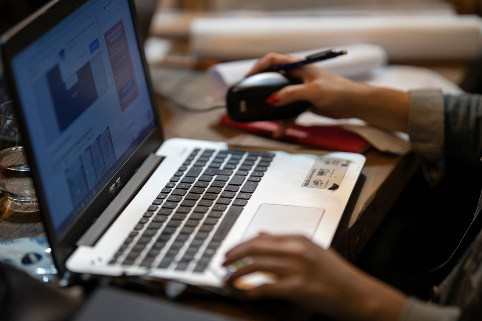Laptop with hands on